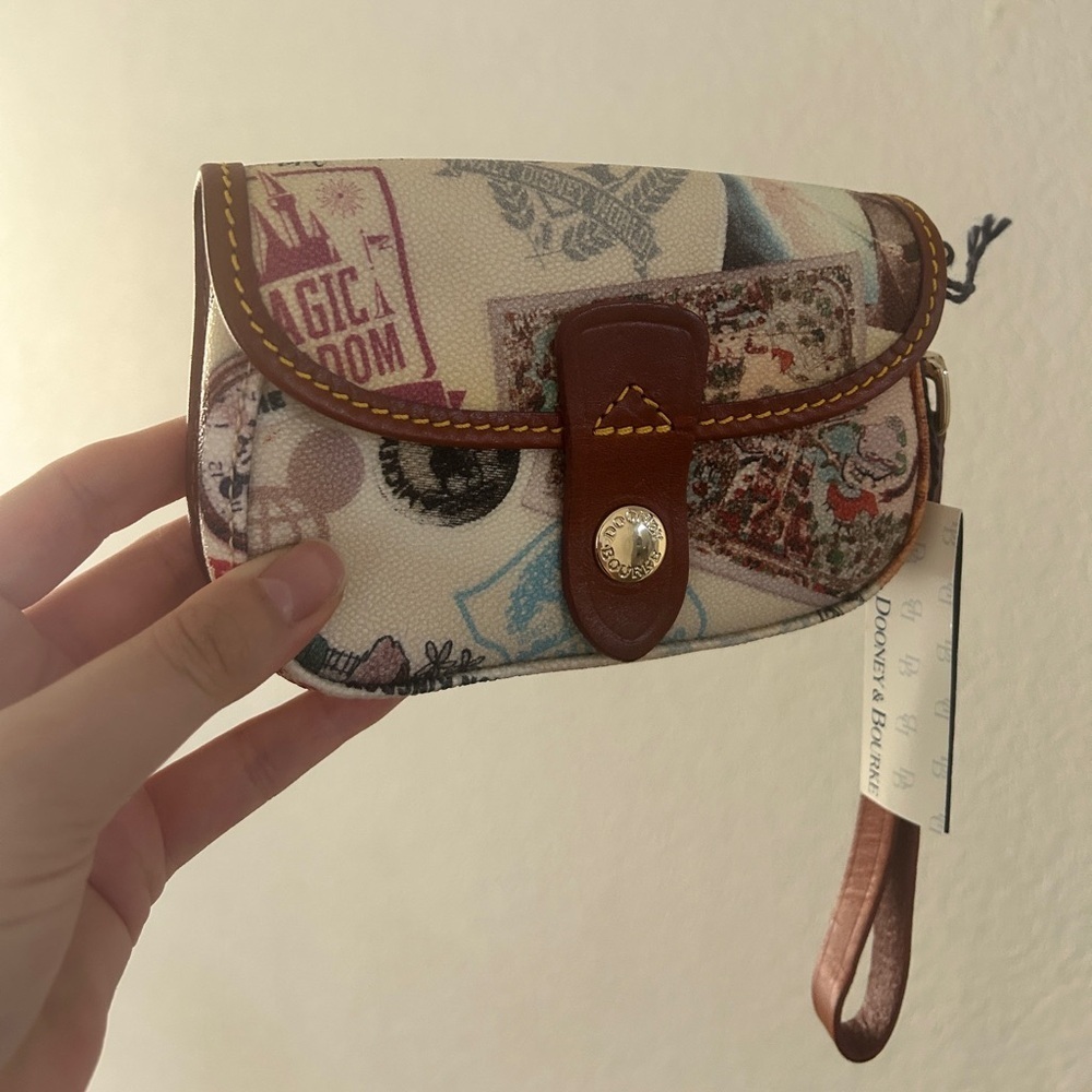 Dooney & Bourke Disney Parks Wristlet -Vintage Postcard Magic Kingdom Print- NWT - Picture 2 of 11